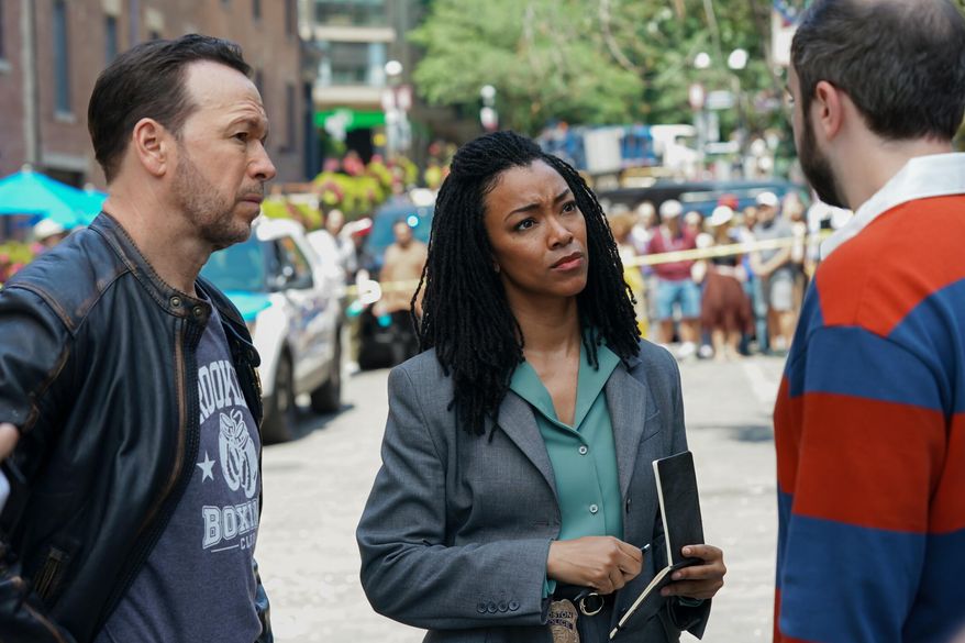 This image released by CBS shows Donnie Wahlberg, left, and Sonequa Martin-Green in a scene from "Boston Blue." (John Medland/CBS via AP)