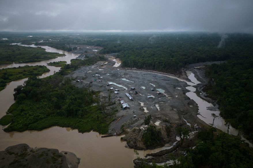 FILE - An illegal mining camp, sits along the Quito River, the Atrato River's main tributary, near Paimado, Colombia, Sept. 23, 2024. (AP Photo/Ivan Valencia, File)