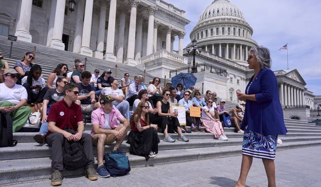 Rep. Robyn Kelly, D-Ill., right, speaks with former federal workers who lost their jobs in President Donald Trump's DOGE layoffs, at the Capitol in Washington on Tuesday, June 10, 2025. (AP Photo/J. Scott Applewhite) **FILE**