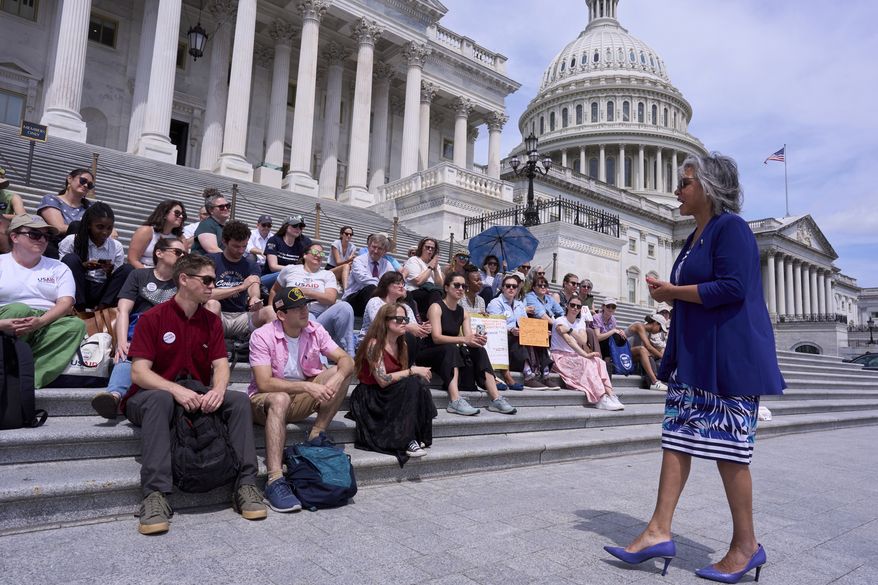 Rep. Robyn Kelly, D-Ill., right, speaks with former federal workers who lost their jobs in President Donald Trump's DOGE layoffs, at the Capitol in Washington on Tuesday, June 10, 2025. (AP Photo/J. Scott Applewhite) **FILE**