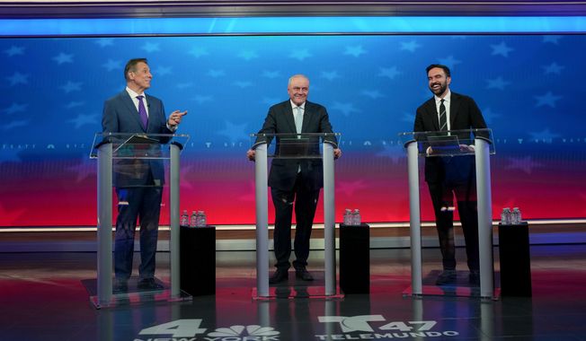 From left, Mayoral candidates Independent candidate former New York Gov. Andrew Cuomo, Republican candidate Curtis Sliwa and Democratic candidate Zohran Mamdani participate in a mayoral debate, Thursday, Oct. 16, 2025, in New York. (AP Photo/Angelina Katsanis, Pool)