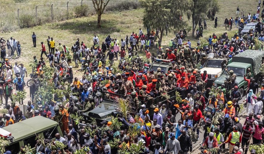Mourners gather for the arrival of the body of Kenya's former Prime Minister Raila Odinga arrives in Nairobi, Kenya, a day after he died in India, Thursday, Oct. 16, 2025. (AP Photo/Samson Otieno)