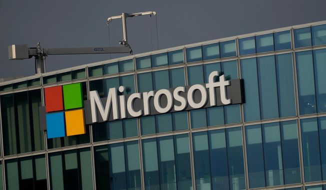 FILE - The logo of Microsoft is seen outside its French headquarters in Issy-les-Moulineaux, outside Paris on May 13, 2024. (AP Photo/Thibault Camus, File)