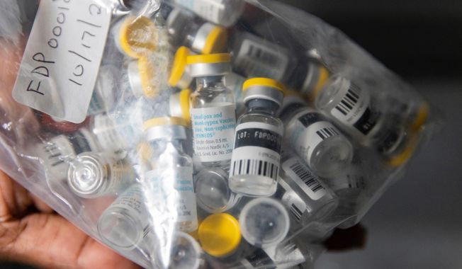 FILE - Vials of the Jynneos vaccine for monkeypox are taken from a cooler at a vaccinations site, Aug. 29, 2022, in the Brooklyn borough of New York. (AP Photo/Jeenah Moon, File)