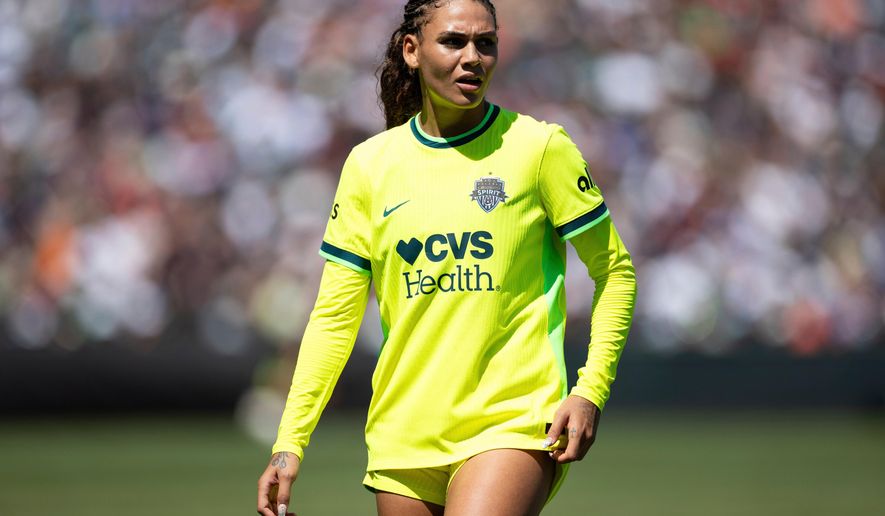 FILE - Washington Spirit's forward Trinity Rodman stands during the second half of a NWSL soccer match against Bay FC on Aug. 23, 2025, in San Francisco. (AP Photo/Benjamin Fanjoy, file)