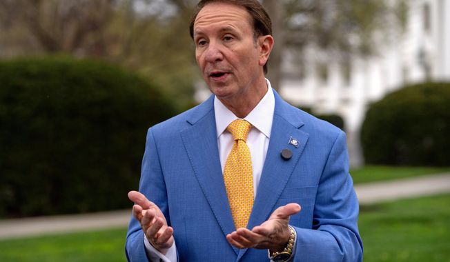 FILE - Louisiana Gov. Jeff Landry records a social media video outside the White House, March 24, 2025, in Washington. (AP Photo/Mark Schiefelbein, file)
