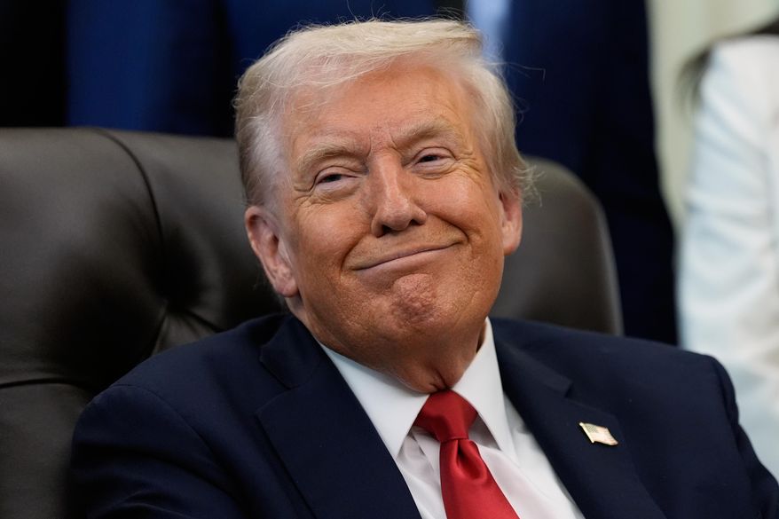 President Donald Trump listens as Sen. Katie Britt, R-Ala., speaks in the Oval Office of the White House, Thursday, Oct. 16, 2025, in Washington. (AP Photo/Alex Brandon)