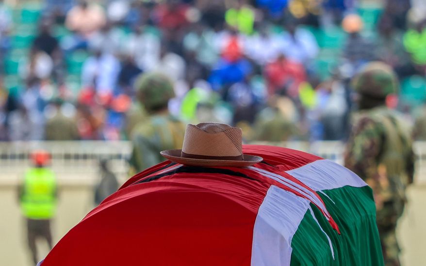 A signature cowboy hat that former Kenya Prime Minister Raila Odinga loved to wear lies on top of his coffin during his state funeral at Nyayo National Stadium in Nairobi, Kenya, Friday, Oct. 17, 2025. (AP Photo/Andrew Kasuku)