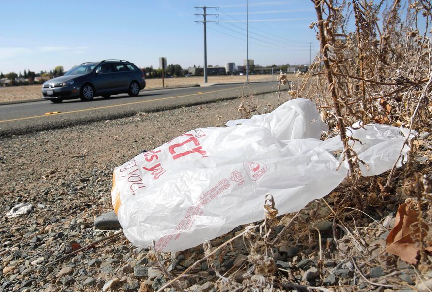A plastic shopping bag liters the roadside in Sacramento, Calif, Friday, Oct. 25, 2013. (AP Photo/Rich Pedroncelli, file)