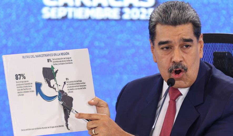 Venezuela's President Nicolas Maduro points at a map of the Americas during a news conference in Caracas, Venezuela, Sept 15, 2025. (AP Photo/Jesus Vargas), File