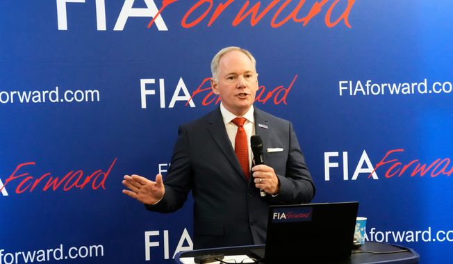 FILE - Tim Mayer, the son of former McLaren team principal Teddy Mayer addresses the media after announcing that he is running for the presidency of motorsport's governing body the FIA in December's election, in Whittlebury Park, England, Friday, July 4, 2025. (AP Photo/Darko Bandic, file )