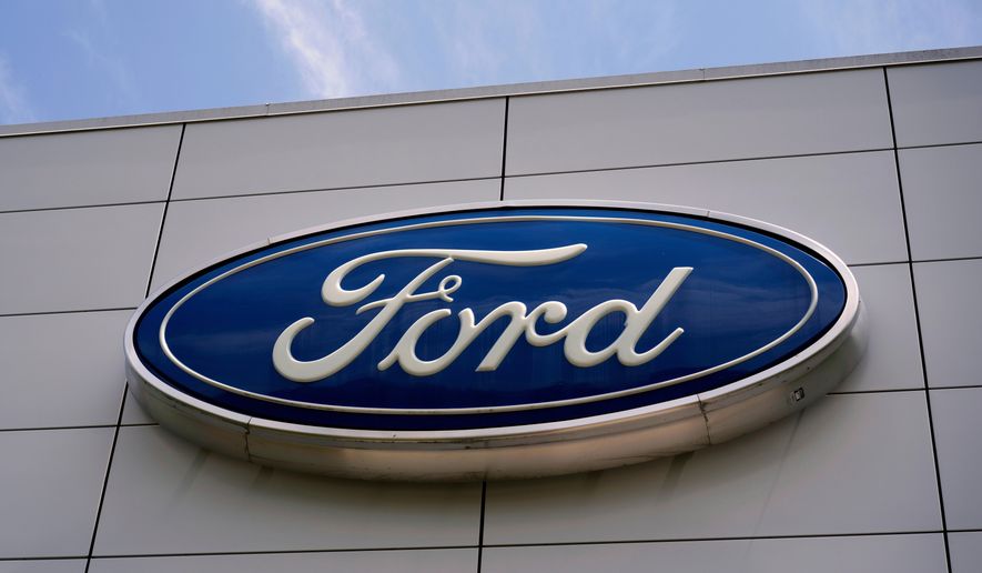 FILE - The Ford logo is seen above the entrance to the Ford Motor Company Kentucky Truck Plant, Wednesday, April 30, 2025, in Louisville, Ky. (AP Photo/Carolyn Kaster, File)