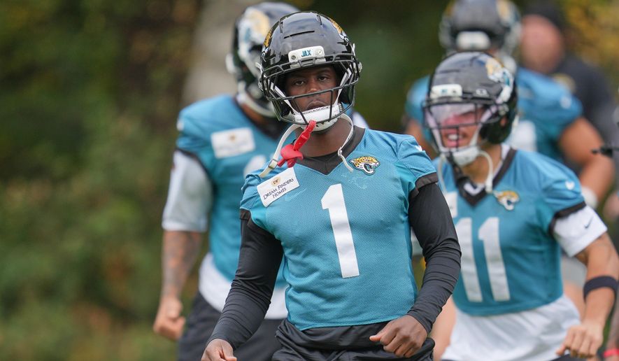 Jacksonville Jaguars running back Travis Etienne (1), works out during an NFL football practice at The Grove in Watford, England, Friday, Oct. 17, 2025. (AP Photo/Kin Cheung)