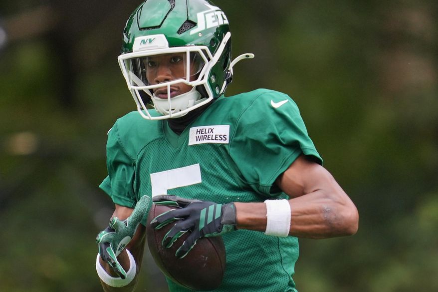 New York Jets wide receiver Garrett Wilson (5) works out during NFL football practice at The Grove in Watford, England, Wednesday, Oct. 8, 2025. (AP Photo/Kin Cheung)