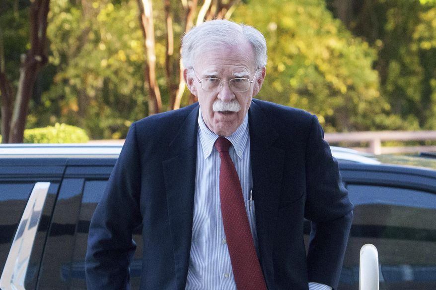 Former Trump administration National Security Adviser John R. Bolton, left, arrives for his arraignment at the Greenbelt Federal Courthouse in Greenbelt, Md., Friday, Oct. 17, 2025. (AP Photo/Rod Lamkey, Jr.)