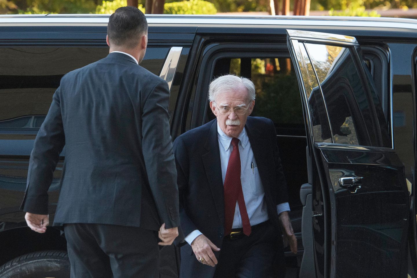 Bolton arrives at court to surrender to authorities on charges in classified information case