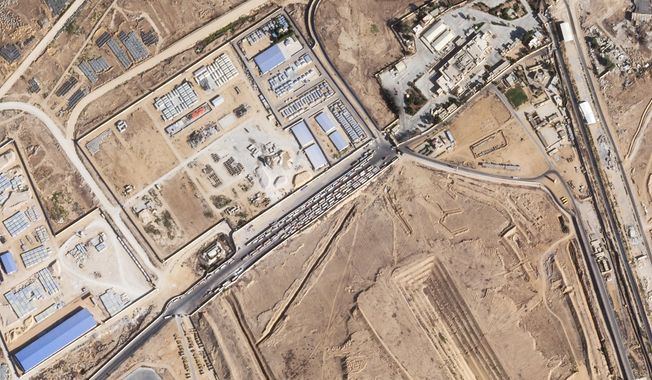 This satellite photo from Planet Labs PBC shows trucks lined up on the Egyptian side of the Rafah border crossing with the Gaza Strip on Thursday, Oct. 16, 2025. (Planet Labs PBC via AP)