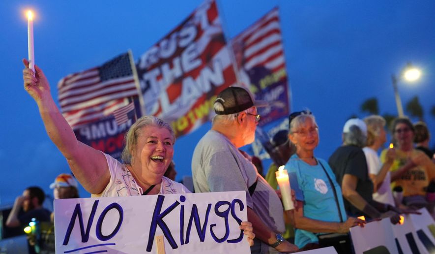 Dee Cahill of Margate, Fla., holds a "No Kings" sign as she participates in a pro-democracy, anti-Trump protest outside Trump's Mar-a-Lago estate in Palm Beach, Fla., on Thursday, July 17, 2025. (AP Photo/Rebecca Blackwell) **FILE**