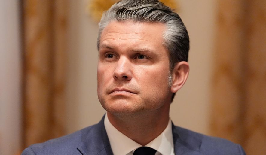 Defense Secretary Pete Hegseth listens as President Donald Trump speaks before a lunch with Ukraine's President Volodymyr Zelenskyy in the Cabinet Room of the White House, Friday, Oct. 17, 2025, in Washington. (AP Photo/Alex Brandon)