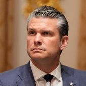 Defense Secretary Pete Hegseth listens as President Donald Trump speaks before a lunch with Ukraine's President Volodymyr Zelenskyy in the Cabinet Room of the White House, Friday, Oct. 17, 2025, in Washington. (AP Photo/Alex Brandon)