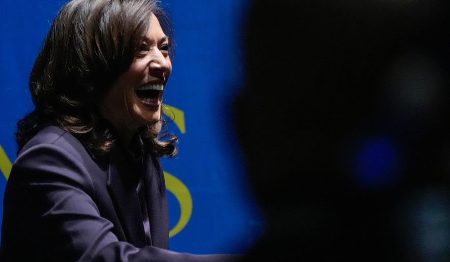 Former Vice President Kamala Harris greets people before she speaks, Friday, Oct. 17, 2025, in Birmingham, Ala. (AP Photo/Mike Stewart)