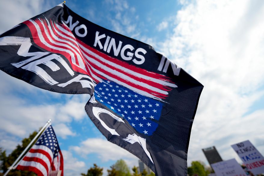 People participate in a "No Kings" rally, Saturday, Oct. 18, 2025, in Birmingham, Ala. (AP Photo/Mike Stewart)