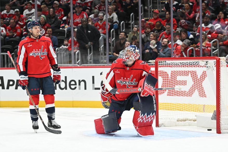 Washington Capitals goalie Charlie Lindgren (79) with the puck in back of him after a goal by Vancouver Canucks forward Evander Kane (91) during the second period of an NHL game at Capital One Arena in Washington D.C., October 19, 2025. (Photo for the Washington Times)