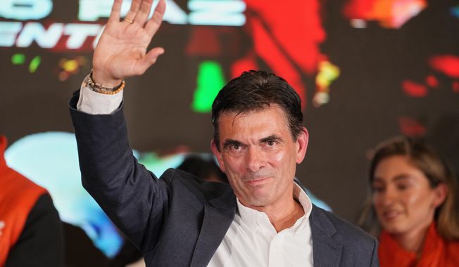 Presidential candidate Rodrigo Paz addresses supporters after preliminary results showed him leading in the presidential runoff election in La Paz, Bolivia, Sunday, Oct. 19, 2025. (AP Photo/Natacha Pisarenko)