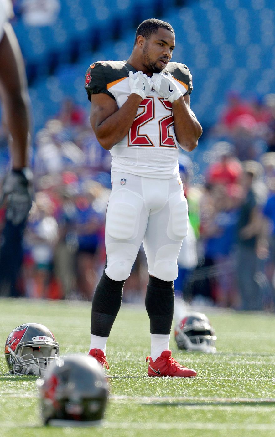 FILE - Tampa Bay Buccaneers running back Doug Martin (22) stretches before an NFL football game against the Buffalo Bills, Sunday, Oct. 22, 2017, in Orchard Park, N.Y. (AP Photo/Adrian Kraus,File)