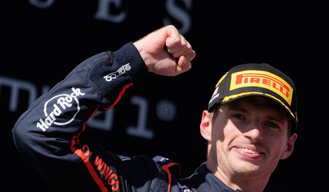 Red Bull driver Max Verstappen of the Netherlands celebrates on the podium after winning the Formula One U.S. Grand Prix auto race in Austin, Texas, Sunday, Oct. 19, 2025. (AP Photo/John Locher)