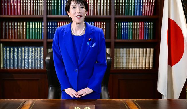 Sanae Takaichi, the newly-elected leader of Japan's ruling party, the Liberal Democratic Party (LDP), gestures as she leaves the party leader's office after the LDP leadership election in Tokyo, on Oct. 4, 2025. (Yuichi Yamazaki/Pool Photo via AP, File)