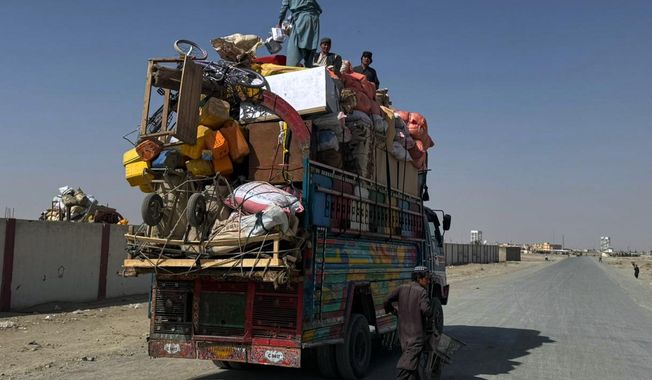 Afghan refugees prepare to leave for their homeland through a border crossing point which partially opens following Pakistan Afghanistan ceasefire truce, at a camp in Chaman, a border town on the Pakistan Afghan border, Sunday, Oct. 19, 2025. (AP Photo/H. Achakzai)