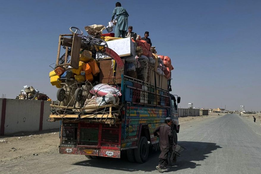 Afghan refugees prepare to leave for their homeland through a border crossing point which partially opens following Pakistan Afghanistan ceasefire truce, at a camp in Chaman, a border town on the Pakistan Afghan border, Sunday, Oct. 19, 2025. (AP Photo/H. Achakzai)