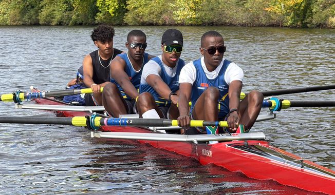 South African rowers, from left, Sheldon Krishnasamy, Lwazi-Tsebo Zwane, Lebone Mokheseng, and Sepitle Leshilo practice on the Charles River in preparation for the Head of the Charles Regatta, Wednesday, Oct. 15, 2025, in Boston. (AP Photo/Rodrique Ngowi)