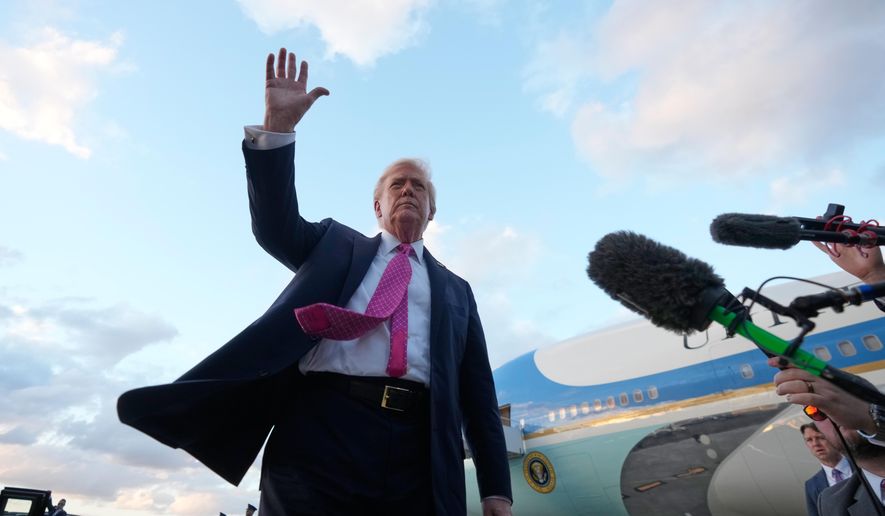 President Donald Trump waves after arriving on Air Force One, Friday, Oct. 17, 2025, at Palm Beach International Airport in West Palm Beach, Fla. (AP Photo/Mark Schiefelbein)