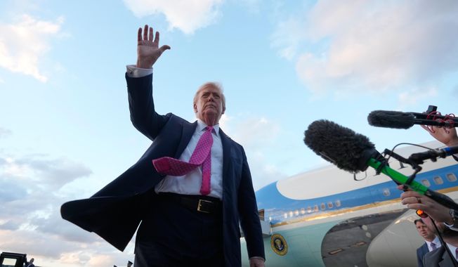President Donald Trump waves after arriving on Air Force One, Friday, Oct. 17, 2025, at Palm Beach International Airport in West Palm Beach, Fla. (AP Photo/Mark Schiefelbein)