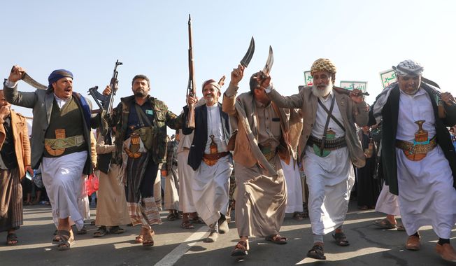Houthi supporters dance as they celebrate following the announcement that Israel and Hamas have agreed to the first phase of a peace plan to pause the fighting, in Sanaa, Yemen, Friday, Oct. 10, 2025. (AP Photo/Osamah Abdulrahman)