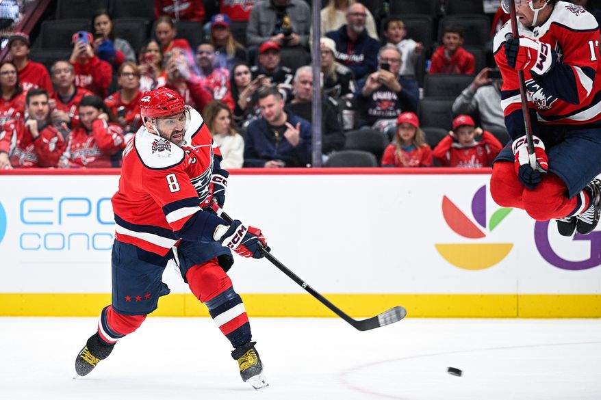 Washington Capitals center Dylan Strome (17) jumps out of the way as left wing Alex Ovechkin (8) fires a wrist shot on net against the Minnesota Wild at Capital One Arena, Washington, D.C., October 17, 2025. (Photo by Brian Murphy for the Washington Times)