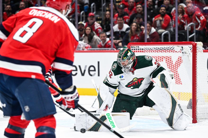 Minnesota Wild goalie Filip Gustavsson (32) kicks saves a shot attempt by Washington Capitals forward Alex Ovechkin (8) at Capital One Arena, Washington, D.C., October 17, 2025. (Photo by Brian Murphy for the Washington Times)