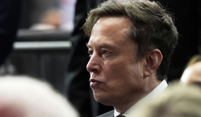 Elon Musk attends a memorial for conservative activist Charlie Kirk, Sunday, Sept. 21, 2025, at State Farm Stadium in Glendale, Ariz. (AP Photo/Julia Demaree Nikhinson)