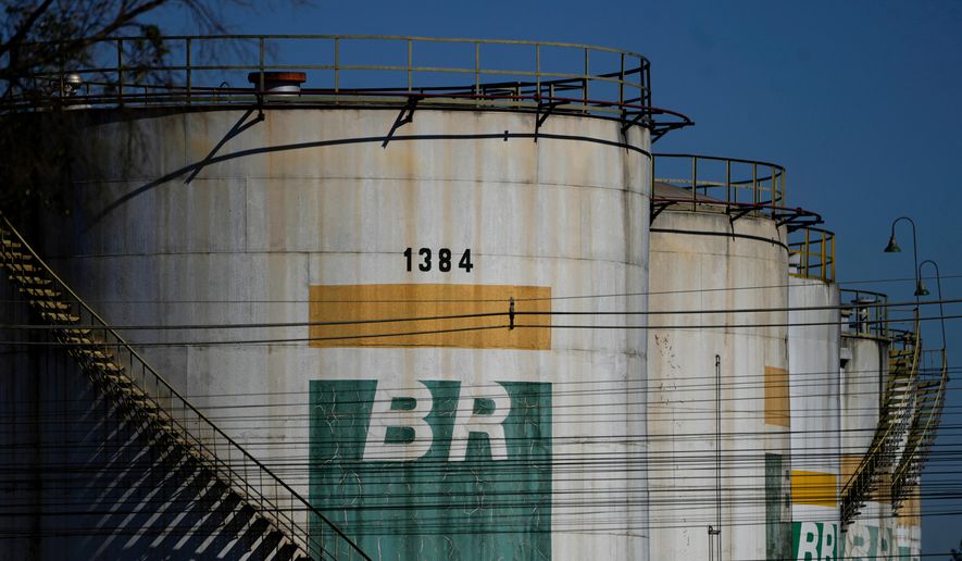 FILE - Fuel reservoirs sit at a distribution center for state-run oil company Petrobras, in Brasilia, Brazil, May 15, 2024. (AP Photo/Eraldo Peres, File)