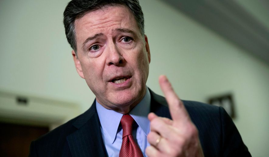 FILE - Former FBI Director James Comey speaks to reporters on Capitol Hill Washington, Dec. 17, 2018. AP Photo/J. Scott Applewhite, File)