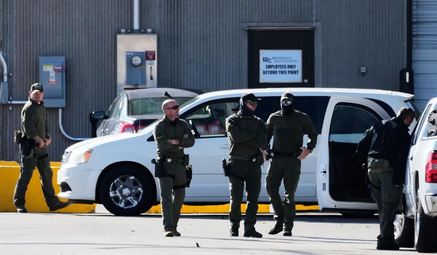 Federal patrol agents stand outside an ICE processing facility in the Chicago suburb of Broadview, Ill., Tuesday, Oct. 21, 2025. (AP Photo/Nam Y. Huh)
