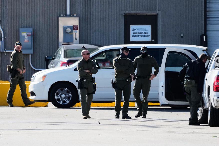 Federal patrol agents stand outside an ICE processing facility in the Chicago suburb of Broadview, Ill., Tuesday, Oct. 21, 2025. (AP Photo/Nam Y. Huh)