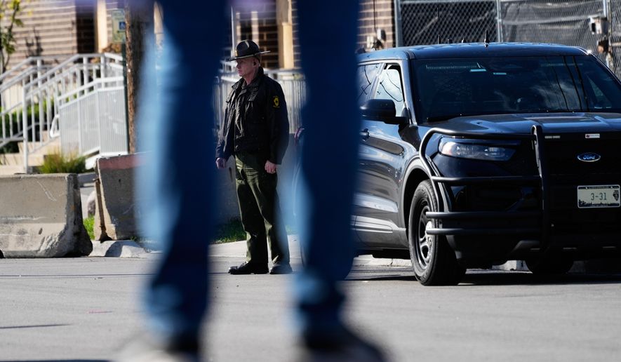 An Illinois State Police officer stands outside an ICE (U.S. Immigration and Customs Enforcement) processing facility in the Chicago suburb of Broadview, Ill., Tuesday, Oct. 21, 2025. (AP Photo/Nam Y. Huh) **FILE**