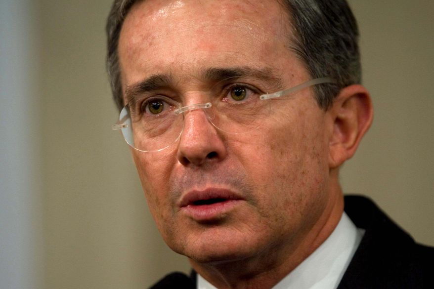 FILE - Alvaro Uribe, President of Colombia, speaks during a news conference in Lima, Peru, May 15, 2008. (AP Photo/Dario Lopez-Mills, File)