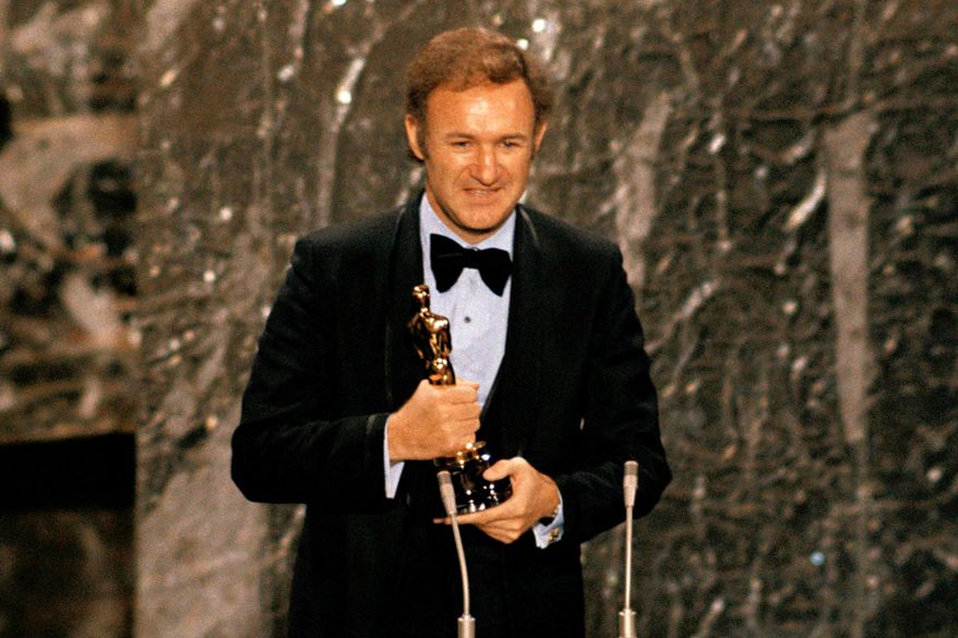 Gene Hackman accepts his Oscar for best actor at the 44th Academy Awards in Los Angeles on April 10, 1972. (AP Photo) **FILE**