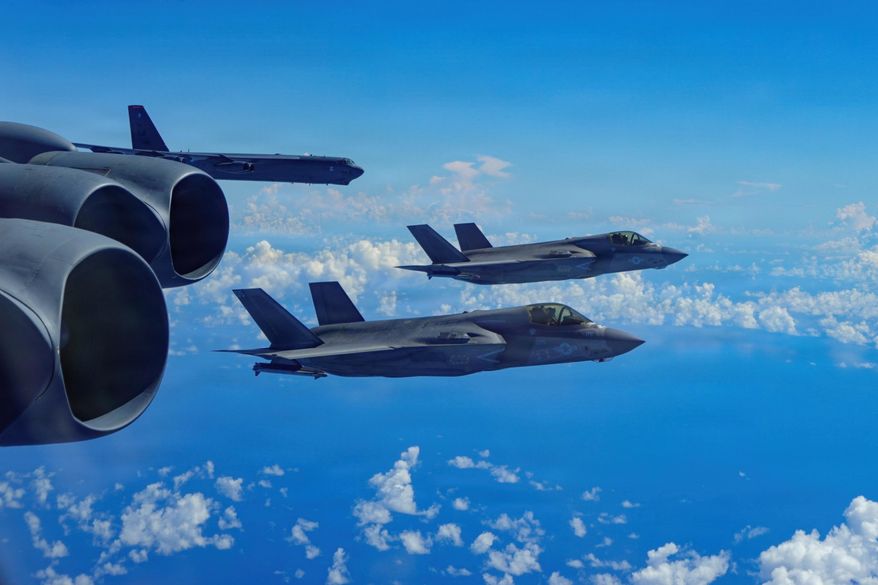 In this image provided by the U.S. Air Force, a Air Force B-52H Stratofortress bomber flies with Marine Corps F-35B Lightning II aircraft in the U.S. Southern Command area of responsibility, Oct. 15, 2025. (U.S. Air Force via AP)