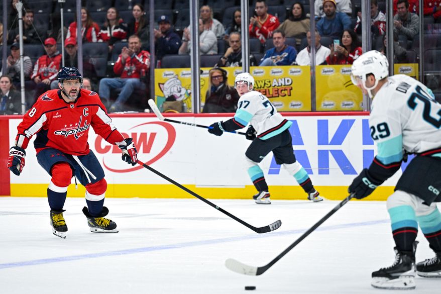 Washington Capitals left wing Alex Ovechkin (8) tracks back on defense as Seattle Kraken defenseman Vince Dunn (29) skates the puck up the ice at Capital One Arena, Washington, D.C., October 21, 2025. (Photo by Brian Murphy for the Washington Times)