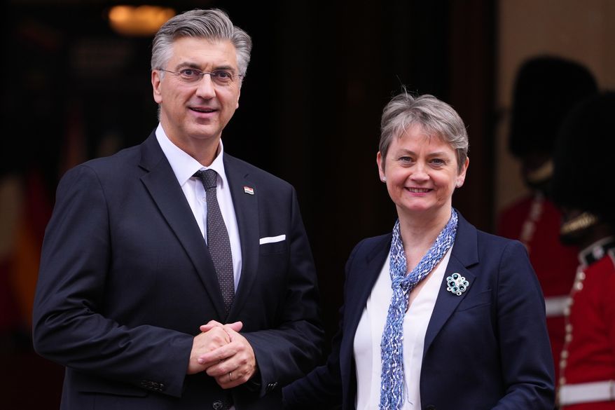 Britain's Foreign Secretary Yvette Cooper welcomes Croatia's Prime Minister Andrej Plenkovic to a meeting of leaders of six Western Balkan nations with British and European officials at a Western Balkans Summit in London, Wednesday, Oct. 22, 2025.(AP Photo/Kirsty Wigglesworth, Pool)